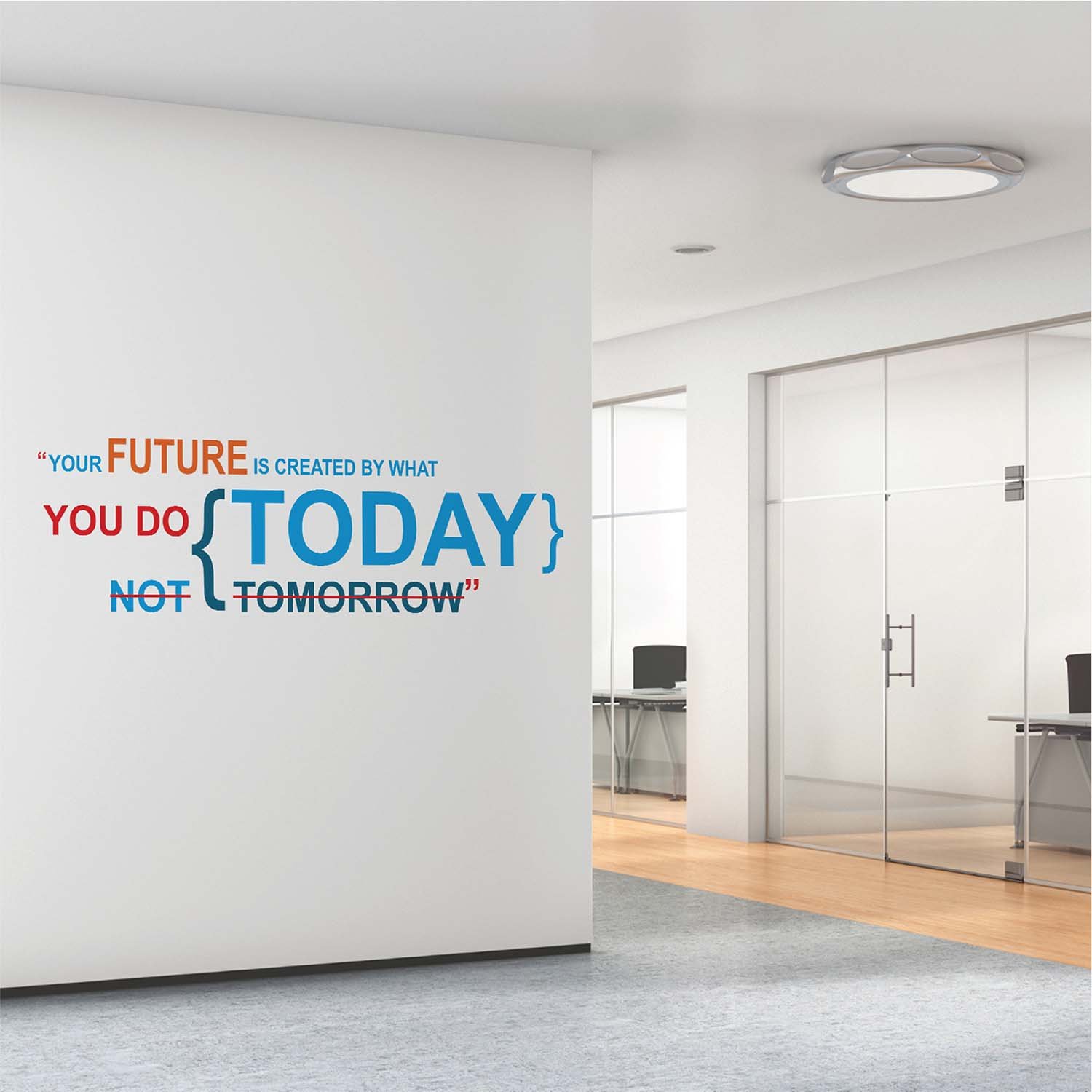 Inspirational quote wall sticker with the text "Your Future Is Created by What You Do Today, Not Tomorrow" applied on an office wall, motivational vinyl wall decal for workspace, study room, home office and corporate interiors.