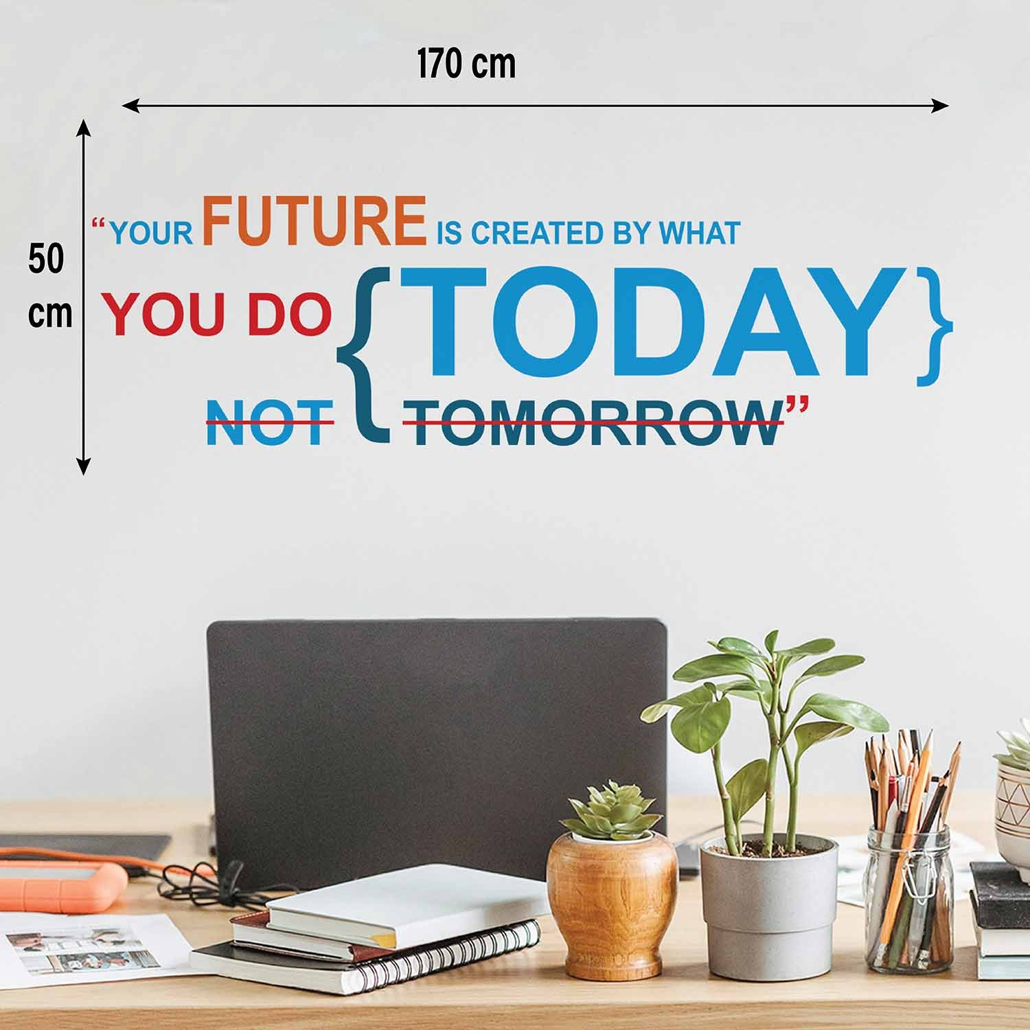 Inspirational quote wall sticker with the text "Your Future Is Created by What You Do Today, Not Tomorrow" applied on an office wall, motivational vinyl wall decal for workspace, study room, home office and corporate interiors.