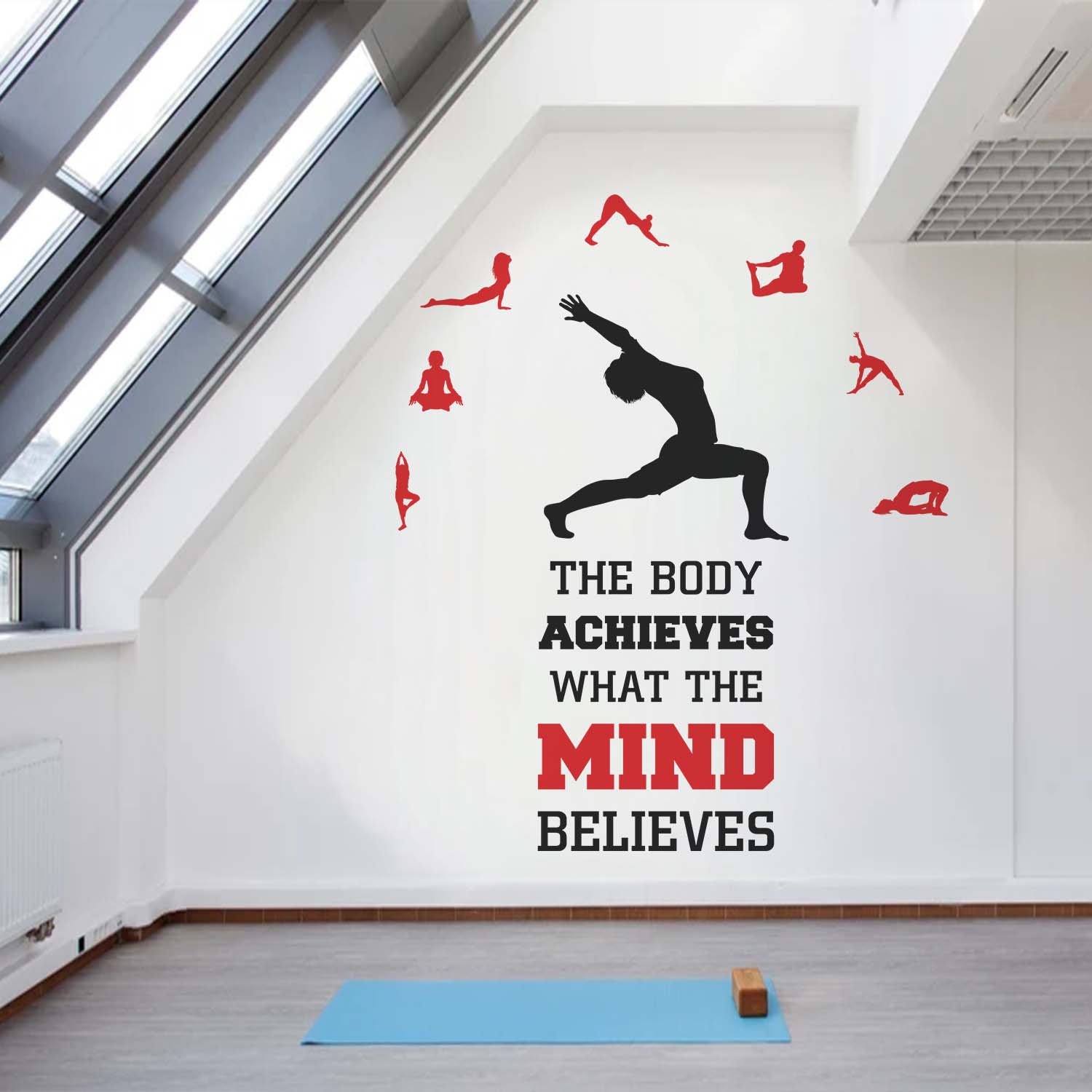 Motivational yoga wall sticker featuring the quote "The Body Achieves What the Mind Believes" with yoga pose silhouettes, ideal for gym walls, yoga studios, fitness centers, meditation rooms, and home workout spaces.