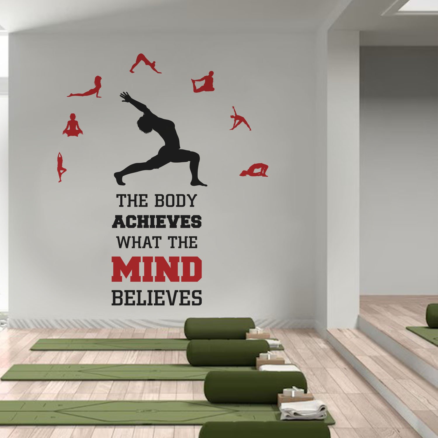 Motivational yoga wall sticker featuring the quote "The Body Achieves What the Mind Believes" with yoga pose silhouettes, ideal for gym walls, yoga studios, fitness centers, meditation rooms, and home workout spaces.