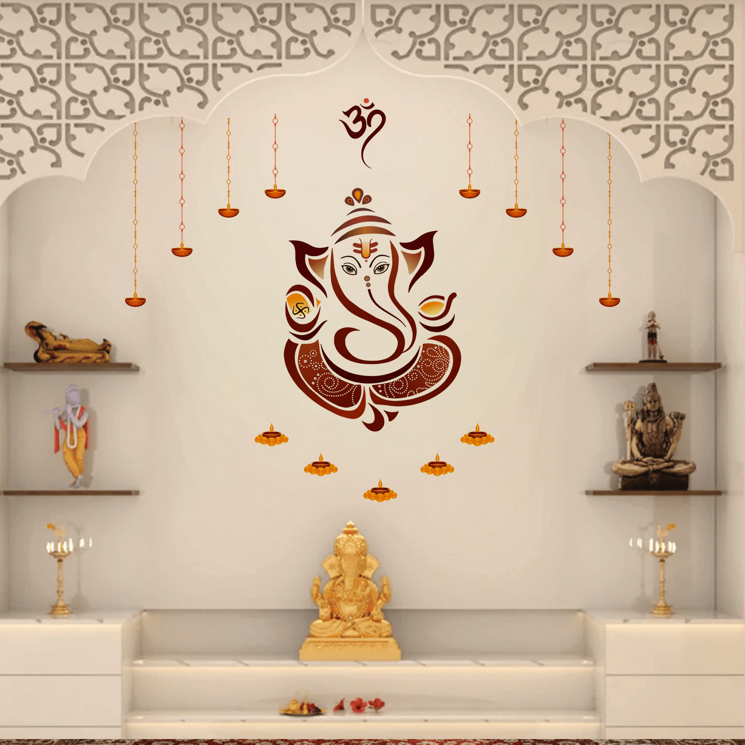 Decorative Lord Ganesha wall sticker featuring an Om symbol, hanging diyas, and floral lamp accents displayed above a wooden pooja altar with brass idols, flowers, and incense in a traditional home temple setting.