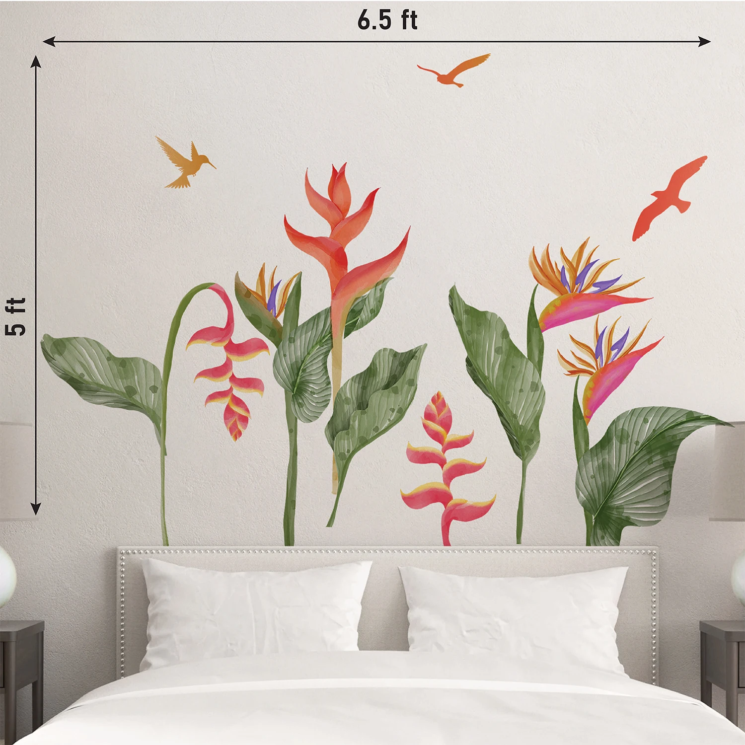 Colorful tropical heliconia and bird of paradise wall sticker with green leaves and flying birds above a bed on a white wall.