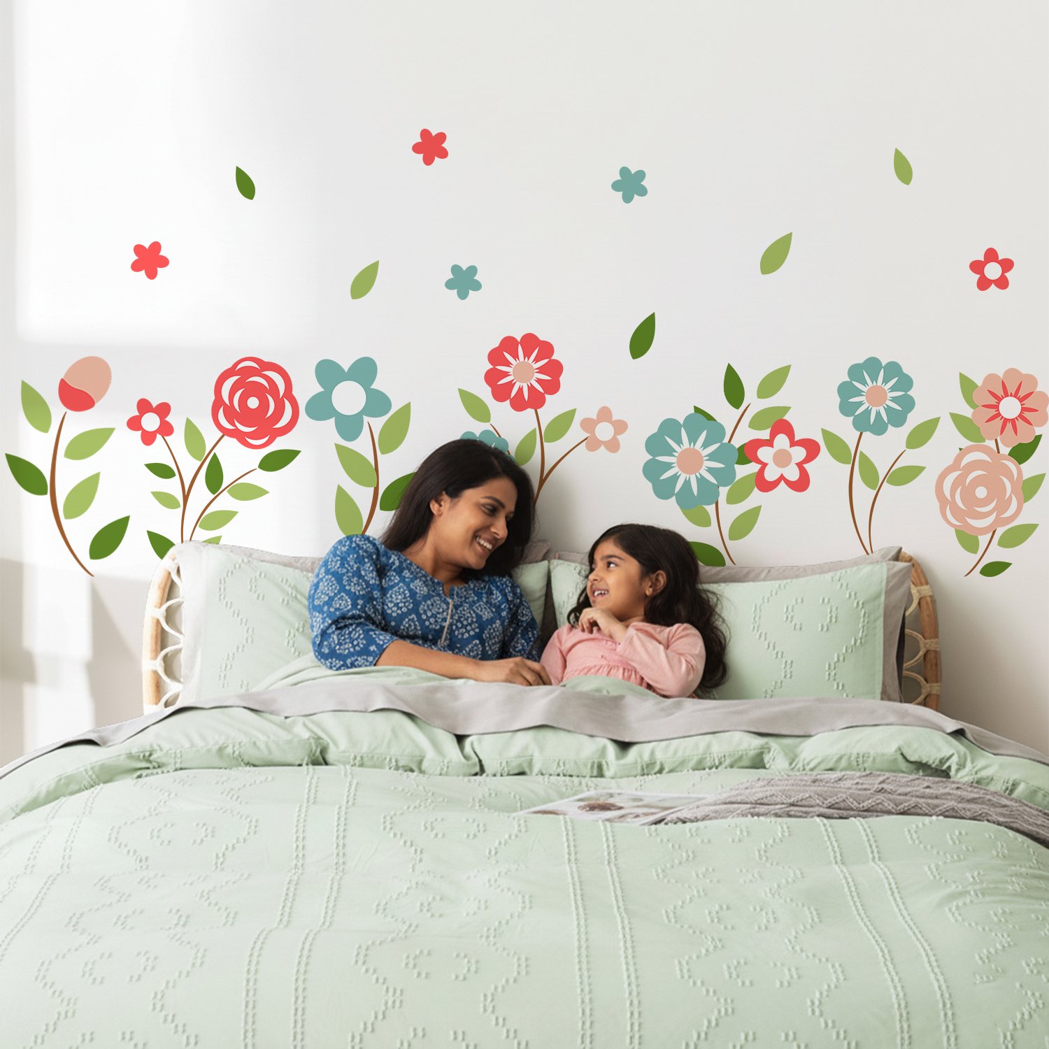 Colorful floral wall stickers for kids bedroom featuring pastel flowers and green leaves above bed decor