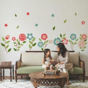 Colorful floral wall stickers for kids bedroom featuring pastel flowers and green leaves above bed decor