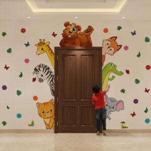 Peekaboo jungle animals kids room wall sticker with cute safari animals like lion, giraffe, elephant, zebra, and crocodile around door frame