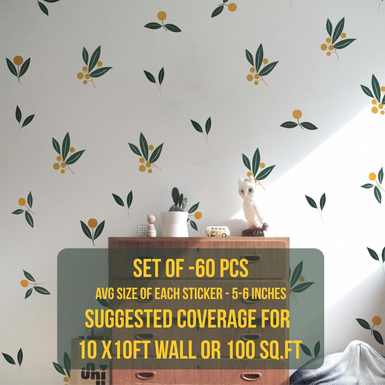 Minimalist botanical wall stickers featuring green leaves and yellow berry motifs arranged in a scattered pattern above a beige sofa in a modern living room.