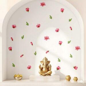 A modern living room featuring removable watercolor-style pink flower and green leaf wall stickers arranged across a white wall above a wooden daybed with patterned cushions.