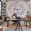 I Love Travel wall sticker with world city names and travel illustrations on a café wall
