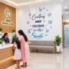 Dental clinic wall sticker featuring Creating and Maintaining a Beautiful Smile quote with cute tooth characters and dental care illustrations.